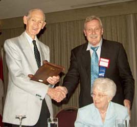 James Charlton receiving a Presidental Award from Chuck Moore